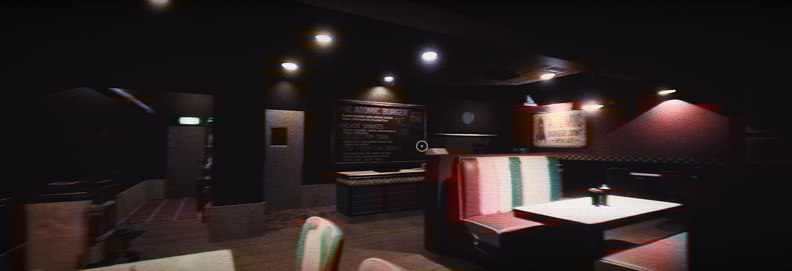 Diner booths in mint and pink vinyl beneath the Atomic Burger menu board